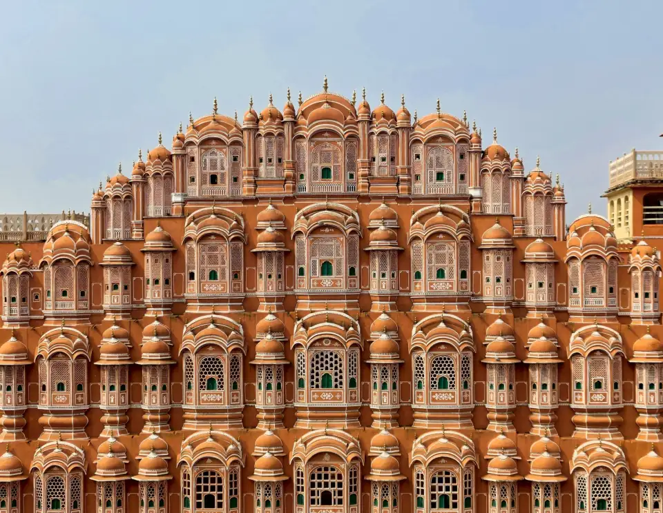 Pink sandstone facade of the Hawa Mahal palace in Jaipur