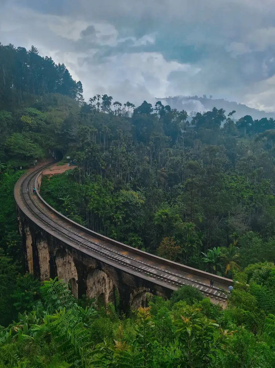 Nine Arches Bridge curving through lush jungle in Ella