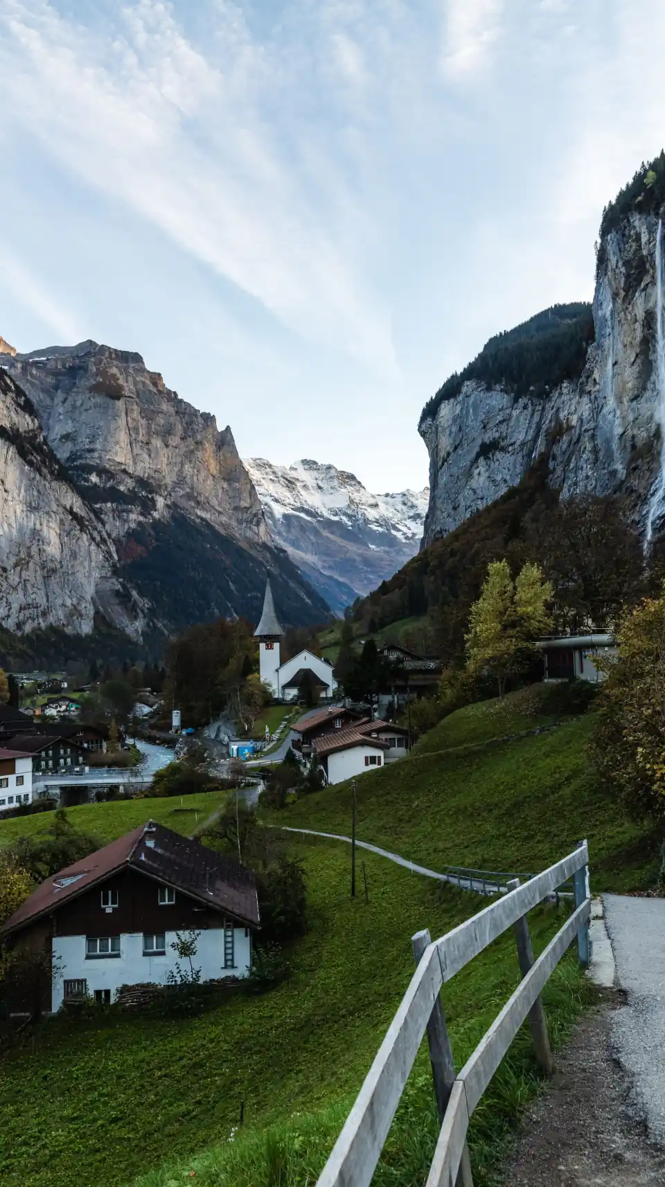 Lauterbrunnen village and church below steep cliffs in the Swiss Alps